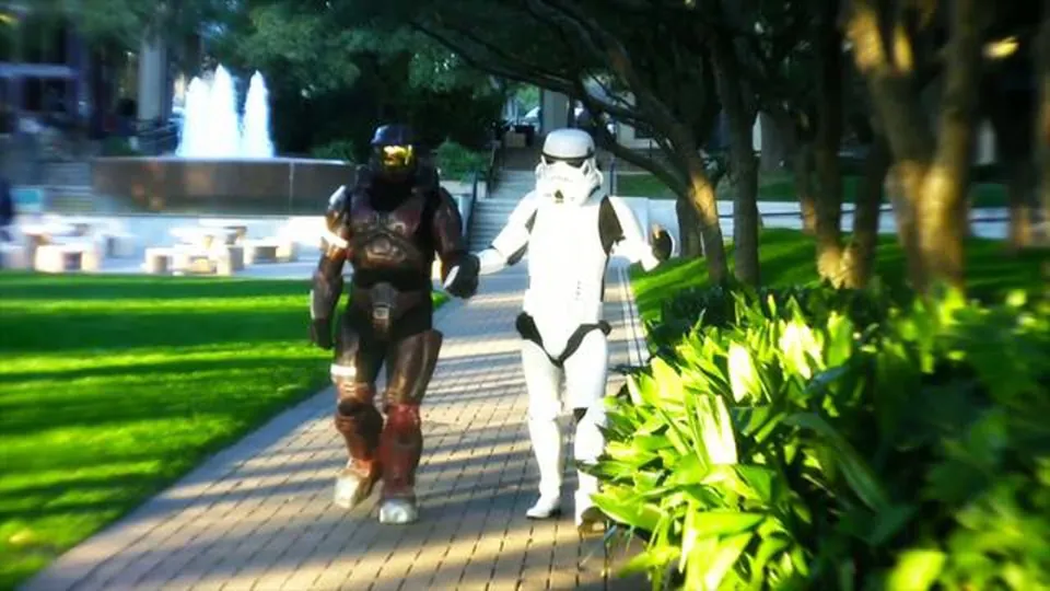A Spartan and a Stormtrooper walk side by side past a fountain, a still from Adam Grumbo's short film